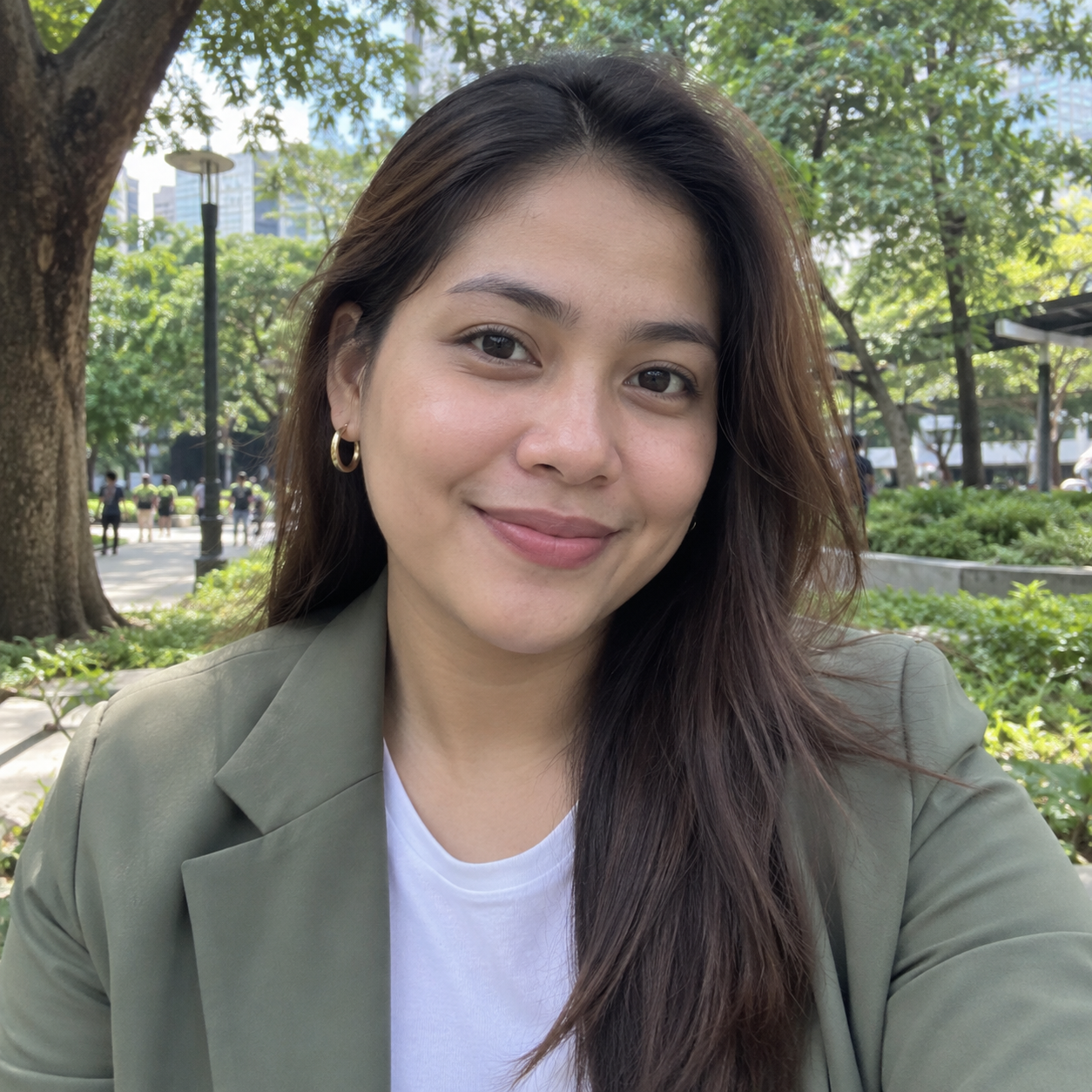 Casual Facebook-style profile photo of a Filipina wearing a modern sage blazer