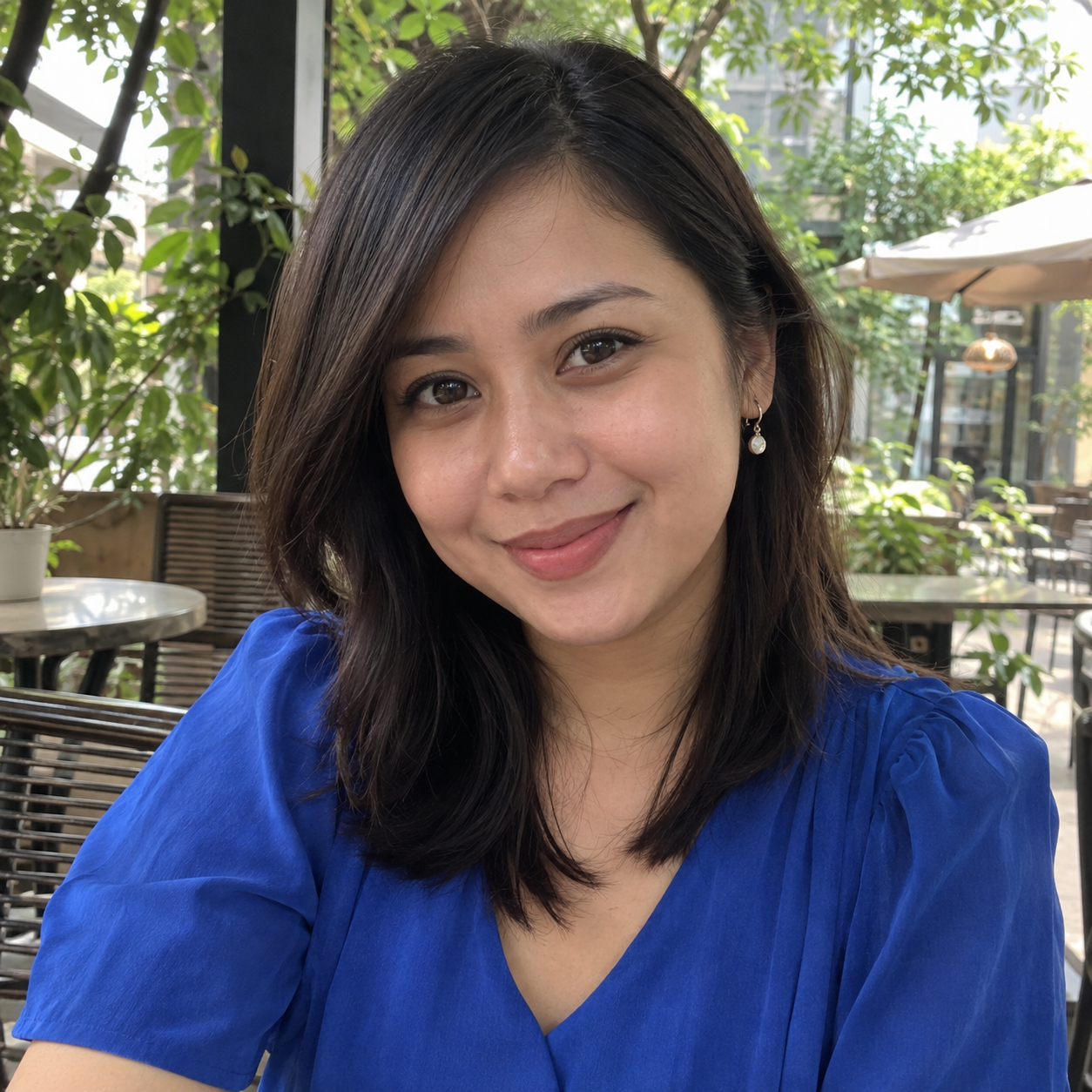 Facebook-style profile photo of a 28-year-old Filipina woman in a modern cobalt-blue blouse