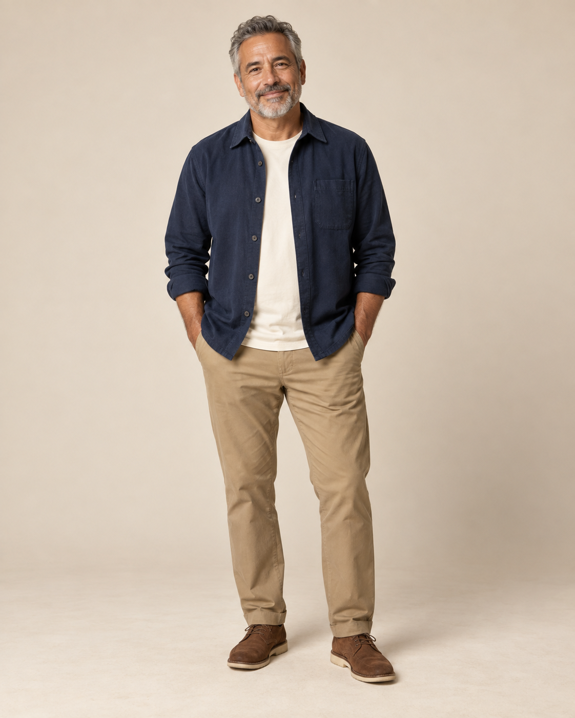 A fictional older musician in a navy overshirt standing in a photography studio