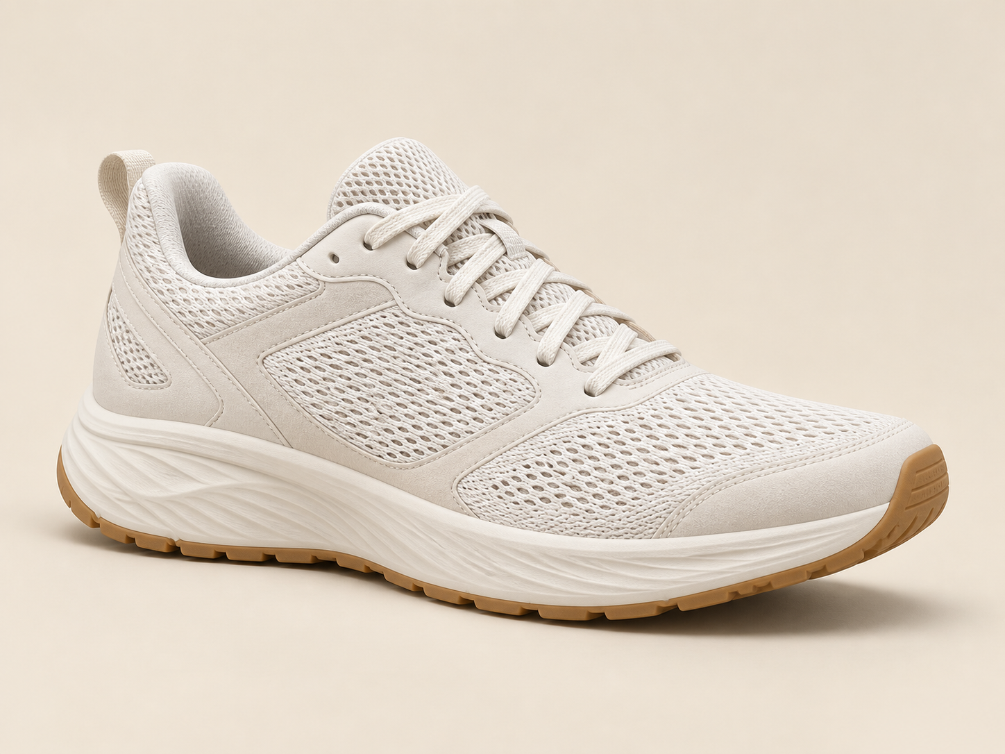 An off-white running shoe photographed on a pale studio backdrop